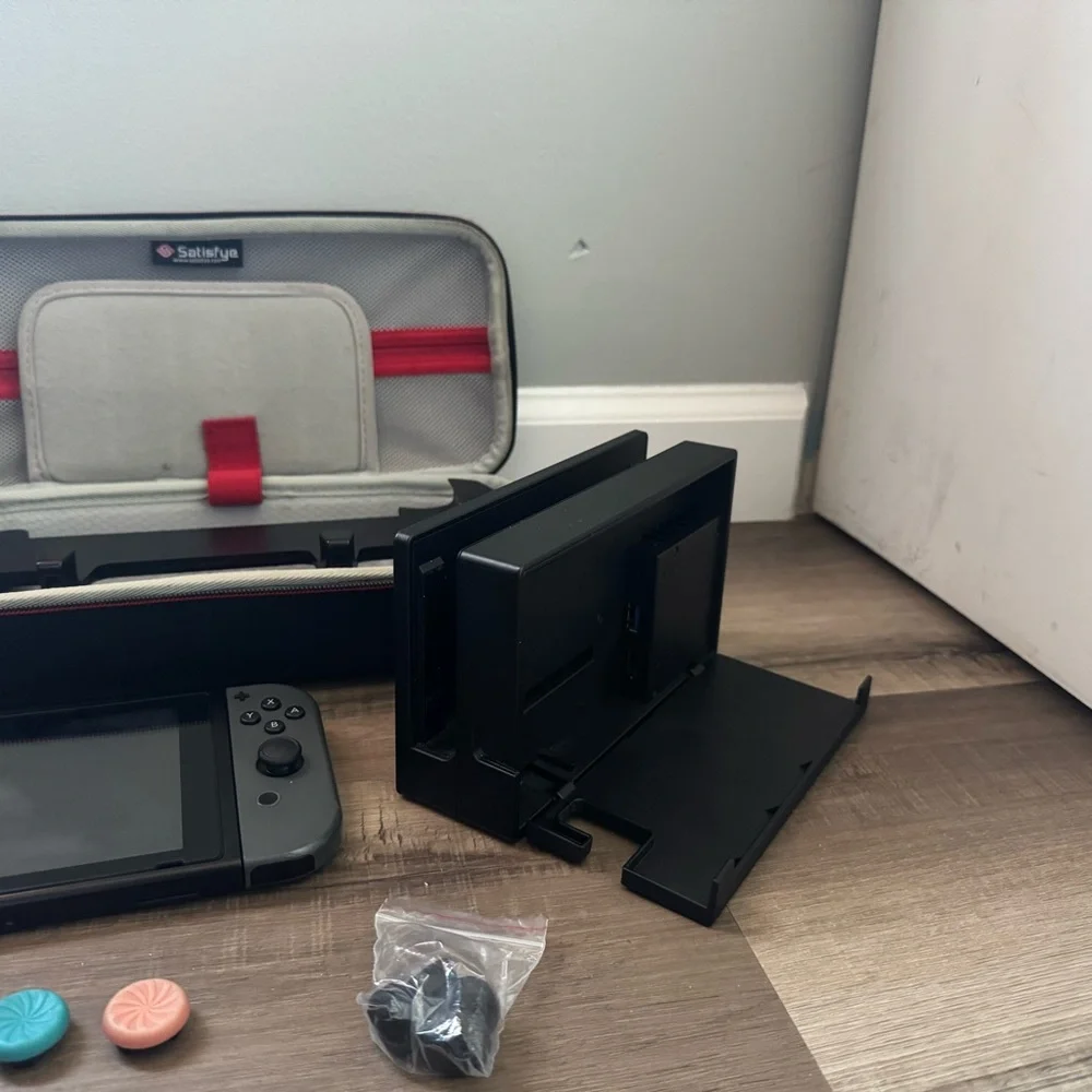 Nintendo Switch with Black and Gray Accessories